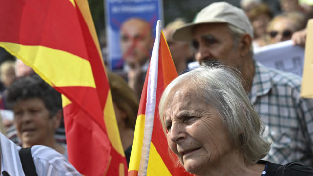 Pensioners shout slogans holding the placard with the picture of the Macedonian Prime Minister Dimitar Kovacevski with the word Resignation